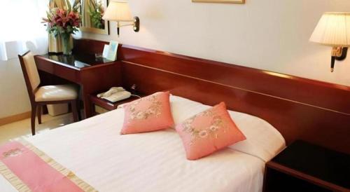 Postel nebo postele na pokoji v ubytování West Hotel
