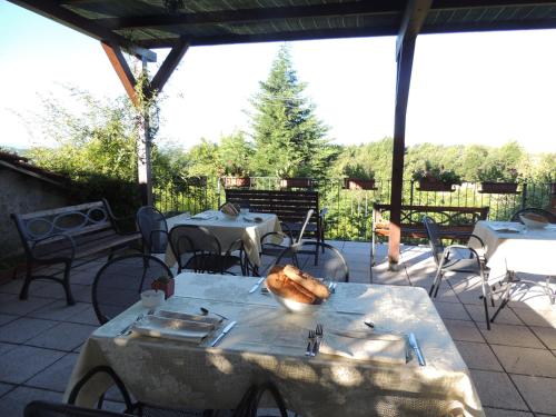 a table with a turkey sitting on it on a patio at Da Fabiana in Bossolasco