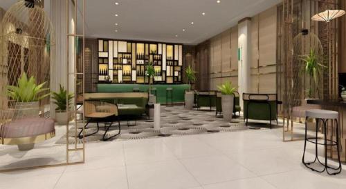 a lobby with tables and chairs in a building at Jinjiang Metropolo Hotel Nanjing Confucius Temple Branch in Nanjing