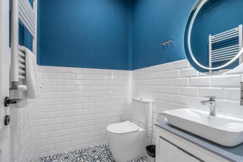 a bathroom with a white toilet and a sink at Villa Ambassadori Kachreti Golf Resort, Kakheti Kachreti in Kachretʼi