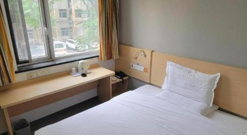 Letto o letti in una camera di 7 Days Inn Tianjin Ancient Cultural Street Jinshiqiao Metro Station