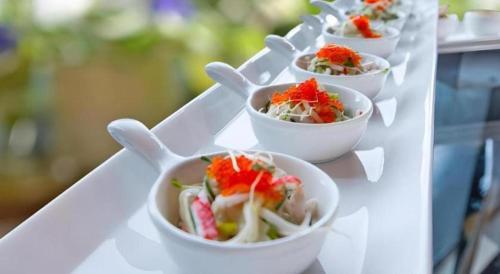 a white tray with small bowls of food on it at Elysion Place Hotel Causeway Bay in Hong Kong