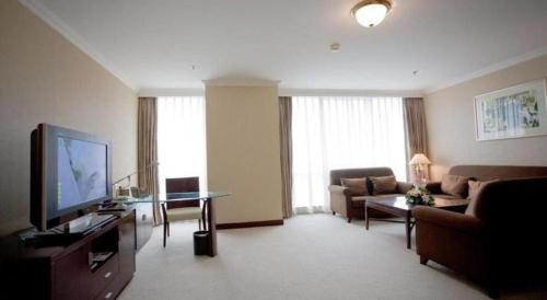 TV a/nebo společenská místnost v ubytování Beijing Jinjiang Fuyuan Hotel