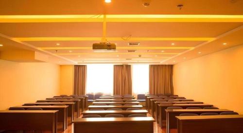 a large room with rows of chairs in it at GreenTree Inn Fuyang Yijing International North Business in Fuyang