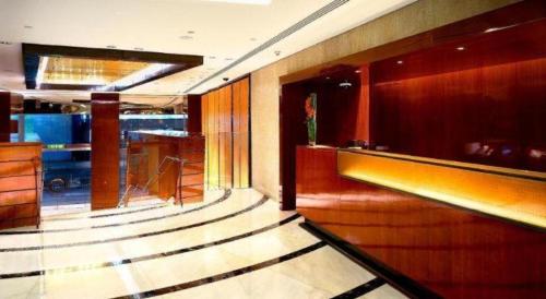 a lobby of a hotel with a bar and a lobby at The Landmark Mandarin Oriental, Hong Kong in Hong Kong