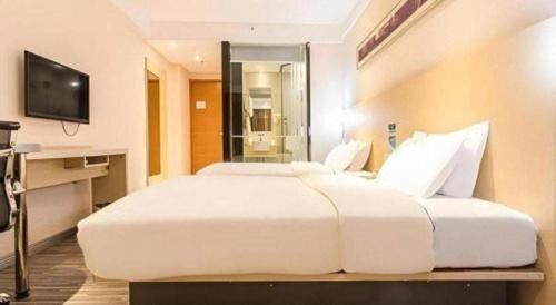 TV a/nebo společenská místnost v ubytování City Comfort Inn Beihai Hepu Bus Terminal