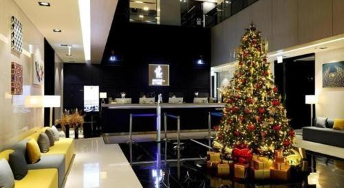 a christmas tree in the middle of a salon at Kintex by K-tree in Goyang