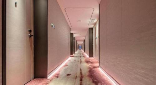 an empty corridor in an office building with a long aisle at Taiyi International Hotel in Wenzhou