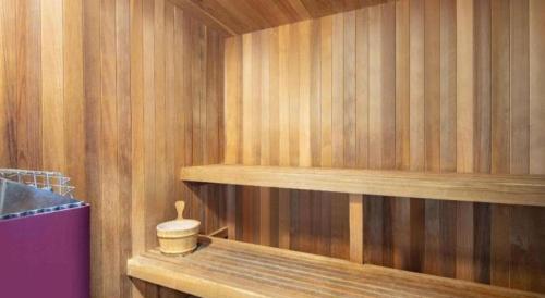 a sauna with wooden walls and wooden shelves at Baymont By Wyndham Laurel in Laurel