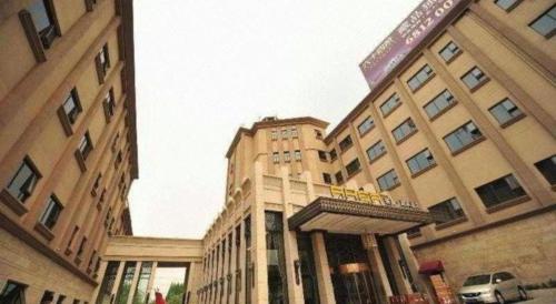 a building with a sign on top of it at New Century Manju Hotel Shanghai New International Expo Center in Shanghai