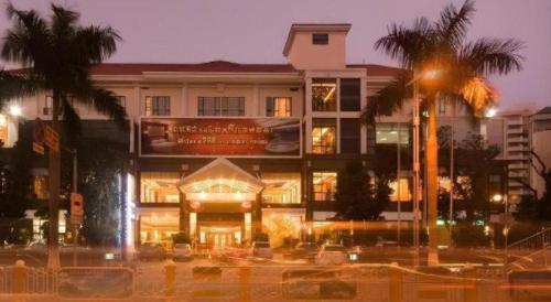 a building with a sign on the front of it at Dong Cheng Hotel in Shunde