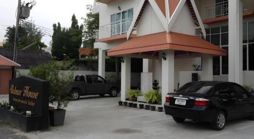 a black car parked in front of a building at Urban House 195 in Chiang Mai