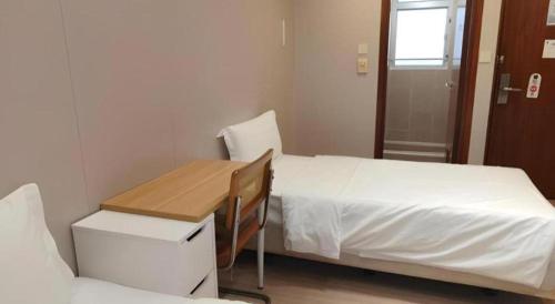 Postel nebo postele na pokoji v ubytování H1 Hotel