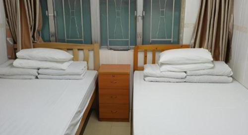 Кровать или кровати в номере New Mong Kok Guest House