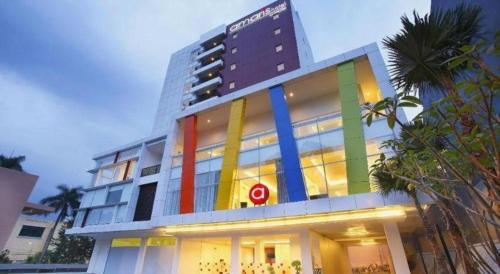 a large building with a rainbow colored facade at Amaris Hotel Pakuan Bogor in Bogor