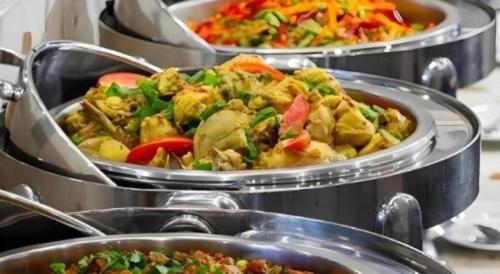 three metal trays filled with different types of food at Amaris Hotel Pakuan Bogor in Bogor