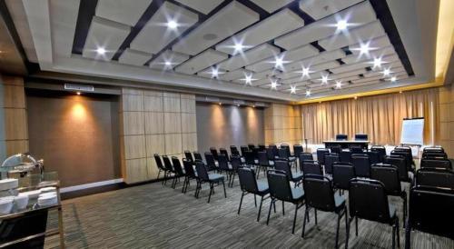 a conference room with a bunch of chairs in it at Brits Hotel Karawang in Karawang