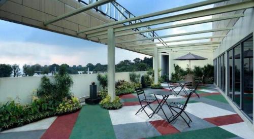 Балкон или терраса в IPB Convention Hotel Botani Square