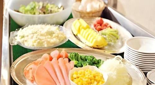 a tray filled with different types of food on plates at Daini Fuji Hotel in Nagoya