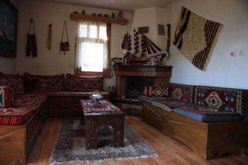 a living room with two couches and a fireplace at Zirve Dağ Evi in Kocaeli