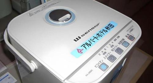 a close up of a electronic device with a sign on it at Albert Hotel in Akita