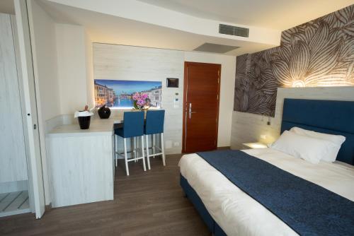 Postel nebo postele na pokoji v ubytování Hotel Cesare Augustus