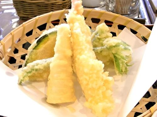 a plate of food with a piece of bread and broccoli at Espoir Misawa in Hakuba