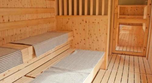 a room with two beds in a sauna at Centrale Hotel Kyotango in Kyotango