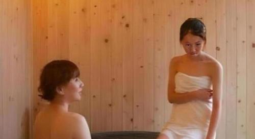a woman in a wedding dress looking at another woman at Hirata Maple Hotel in Izumo