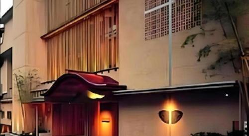 a building with a heart on the side of it at Tsukino Sumika Atami Juraku Hotel in Atami