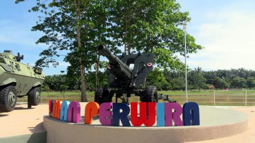 a sign that says rumpilla in front of a military vehicle at PAHANG REST HOUSE @ BERA in Temerloh