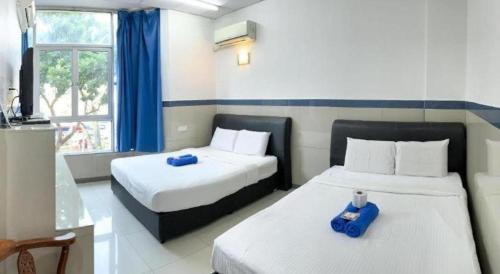 Letto o letti in una camera di Burmahtel Hotel