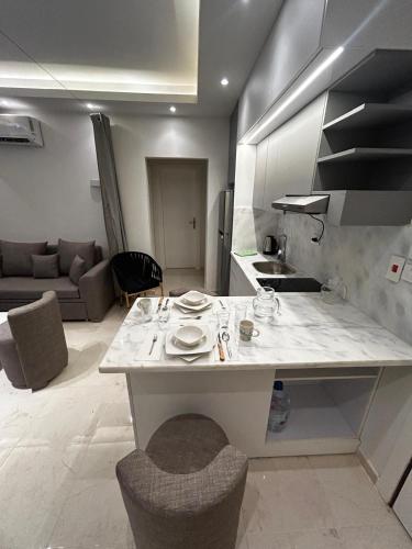 a kitchen and living room with a large counter top at Luxury Apartment in Hurghada