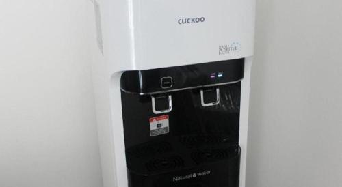 a black object is in a white refrigerator at D Nice Hotel in George Town