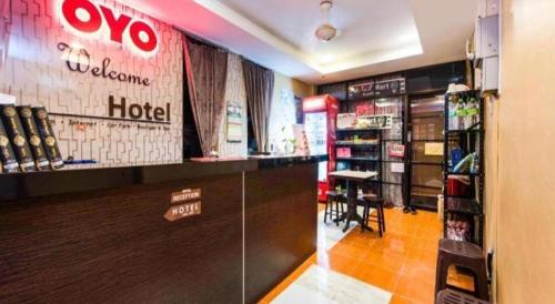 a view of a store with a wolomo hotel at OYO 44123 Hotel Al-Saif in Kuala Kerai
