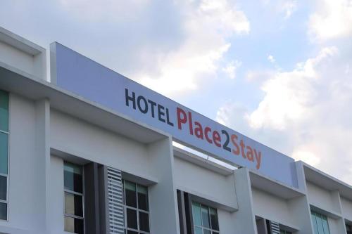 a hospital building with a sign on top of it at Place2stay @ Campus Hub in Kuching