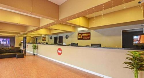 Телевизор и/или развлекательный центр в OYO 90559 Ummul Motel C Mart
