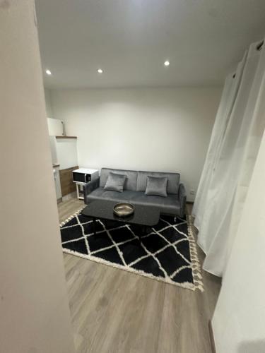 a view of a living room with a couch at Normandy suites in Igé