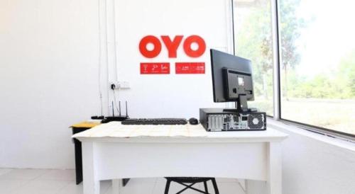 Телевизор и/или развлекательный центр в OYO 89607 Aloha Chalet