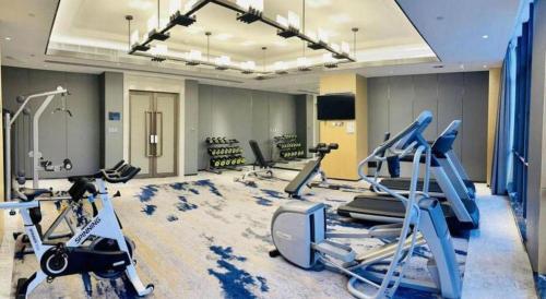 a gym with several exercise bikes in a room at Zhuhai Tangyi Hotel in Zhuhai
