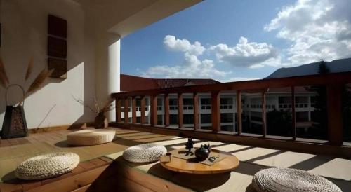a balcony with a view of a building at Kunming Dianchi Garden Hotel & Spa in Kunming