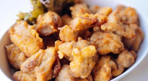 a bowl of fried food with broccoli in it at Hotel Areaone Miyazaki in Miyazaki