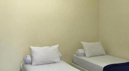 Letto o letti in una camera di Hotel O Wisma Pinggir