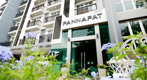 a building with a sign that reads panama apartment at Pannapat Place in Bangkok