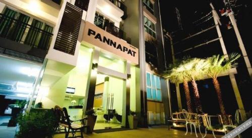 a building with a sign that reads amanazi at Pannapat Place in Bangkok
