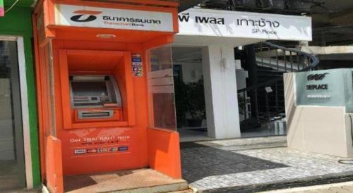 an orange atm machine in front of a building at SP. Place Hotel in Ko Chang