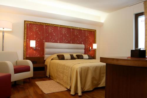 A bed or beds in a room at Hotel Villa Cittar