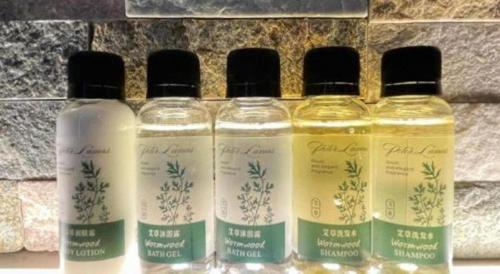 four bottles of essential oils sitting on a counter at Chaozhou Hotel in Chaozhou