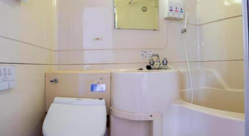 Ванная комната в Tabist Hotel New Osamura Sabae