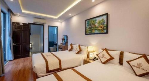 Postel nebo postele na pokoji v ubytování Hoi An Paradise Villa